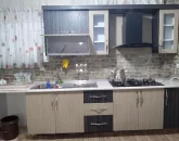 کابینت های کرمی رنگ و هود آشپزخانه خانه روستایی در گرگان